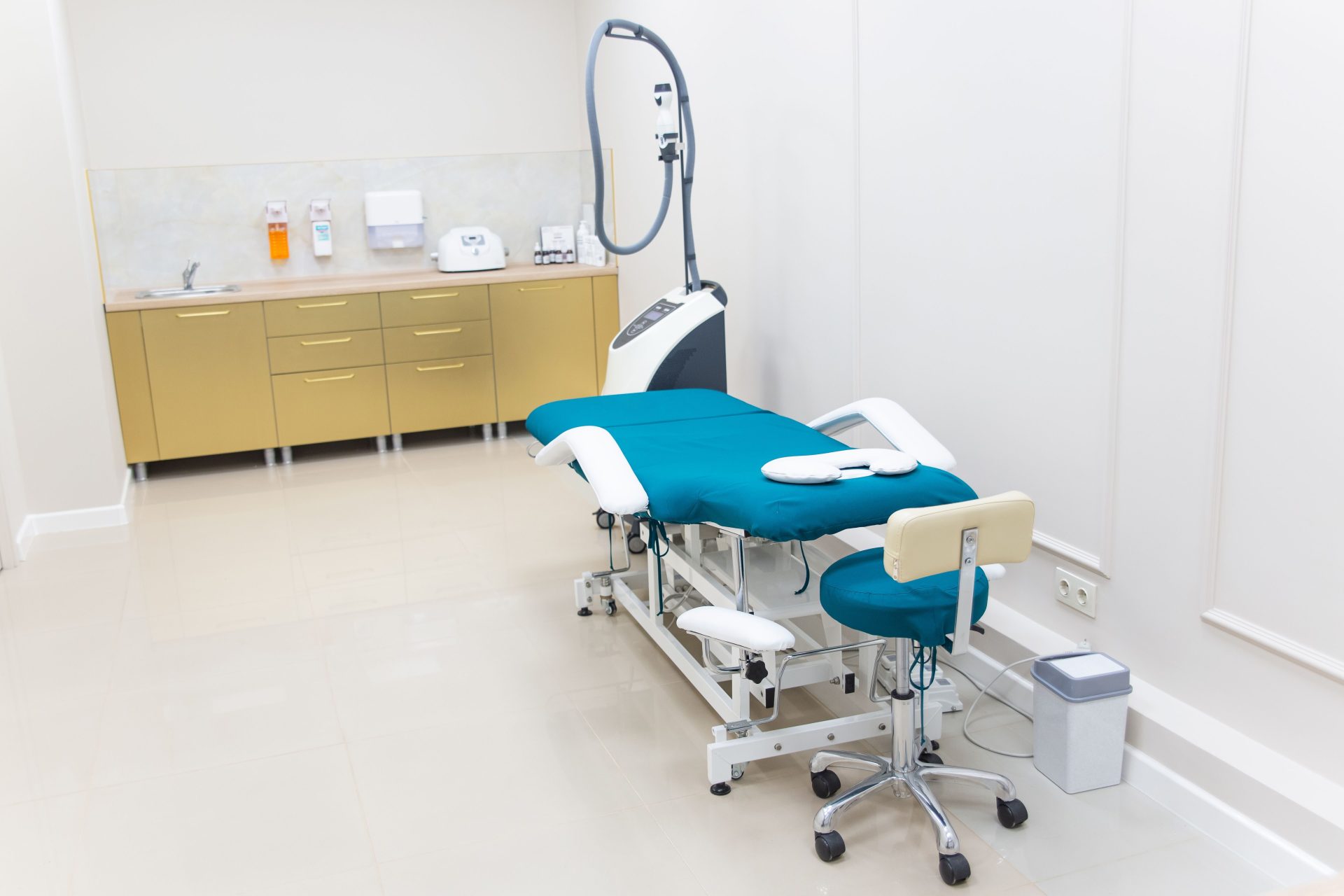 Clean and modern medical examination room with equipment ready for use.